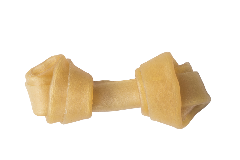 Artificial,A,Bone,For,A,Dog,With,Vitamins,On,White